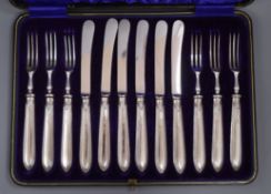 A cased set of six pairs of George V silver handled dessert eaters, Sheffield, 1915.