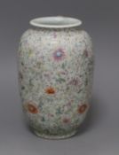 A Chinese famille rose ovoid vase, Qing dynasty, finely painted with flowers and scrolling