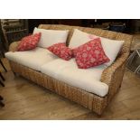 A wove seagrass conservatory sofa W.186cm
