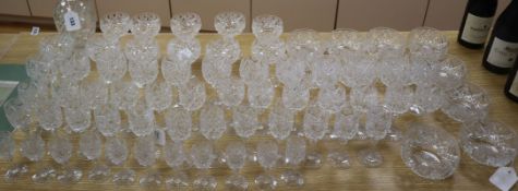 A part suite of star and panel-cut crystal table glass, circa 1916, comprising: a bottle-shaped