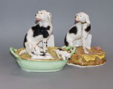 A Staffordshire porcelain group of a pointer and three puppies and a similar figure of a foxhound,