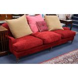 A large red chenille three seat sofa 240cm long
