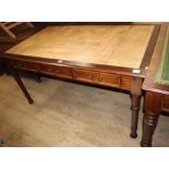 A Victorian style mahogany three drawer writing table W.150cm