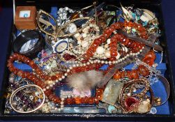 A quantity of assorted costume jewellery including amber necklace, watches etc.