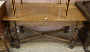 An oak rectangular centre table W.124cm