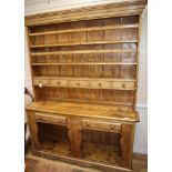 A 19th century Irish pine fiddle front dresser W.164cm