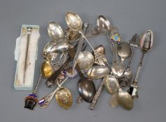 A collection of silver and plated souvenir spoons, a silver pencil holder and propelling pencil