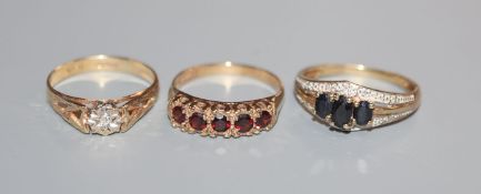 Three assorted 9ct gold gem set rings.