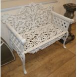 A Coalbrookdale style painted cast iron garden bench W.108cm