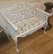 A Coalbrookdale style painted cast iron garden bench W.108cm