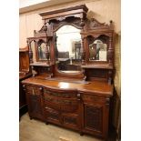 A late Victorian carved walnut bowfront mirror back sideboard W.182cm