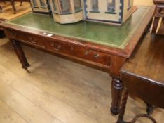 A Victorian mahogany partner's writing table, with green gilt tooled leather inset top W.150cm