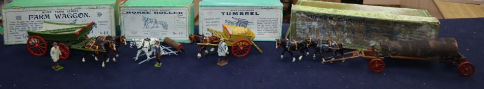 A collection of pre-war Britain's Home Farm series models including a boxed farm wagon, boxed timber