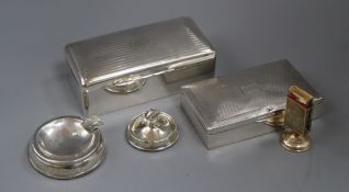 Two silver cigarette boxes, engine-turned and monogrammed and a silver matchbox stand and two