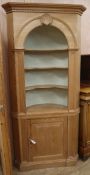 A Georgian style pine barrel back standing corner cabinet, W.92cm