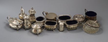 Thirteen assorted silver condiments including mustard pots, pepperettes etc and a silver mounted