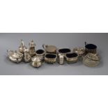 Thirteen assorted silver condiments including mustard pots, pepperettes etc and a silver mounted