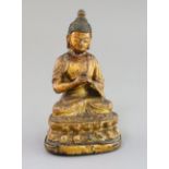 A Chinese gilt lacquered bronze figure of Buddha, 18th/19th century, H. 7.3cm, repair to
