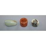 A Chinese Celadon jade pebble snuff bottle and two hardstone archer's rings
