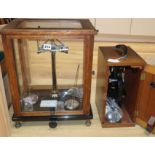 A set of balance scales and a cased "Beck" microscope