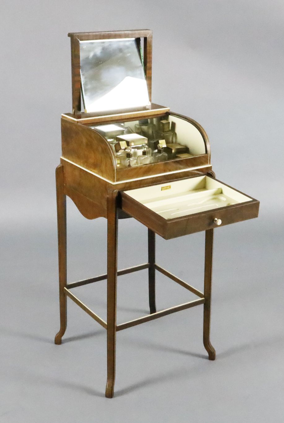 An Art Deco walnut ladies' dressing table by George Betjemann & Sons Ltd for Maple & Co Ltd,
