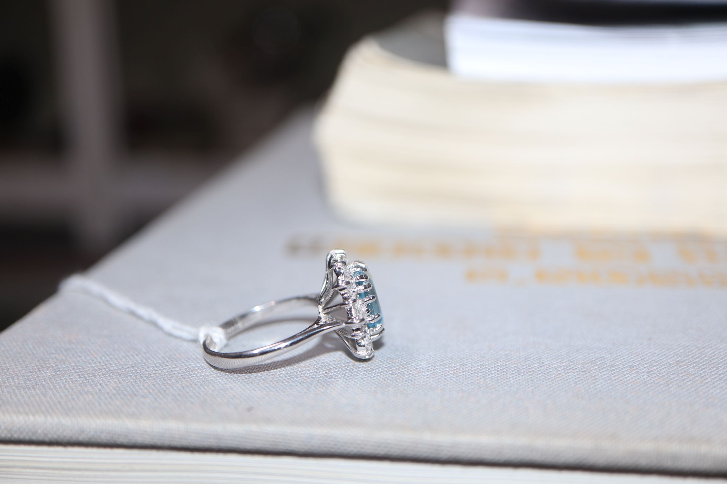 A modern 18ct white metal, aquamarine, baguette and round cut diamond set cluster ring, size K/L. - Image 4 of 6