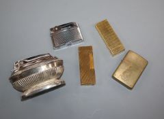 Two Dunhill lighters, a Zippo lighter and two other lighters.