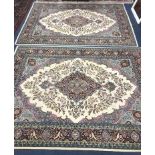 Two Persian style ivory ground rugs 220 x 154cm