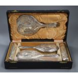 A cased George V silver six piece dressing table set.