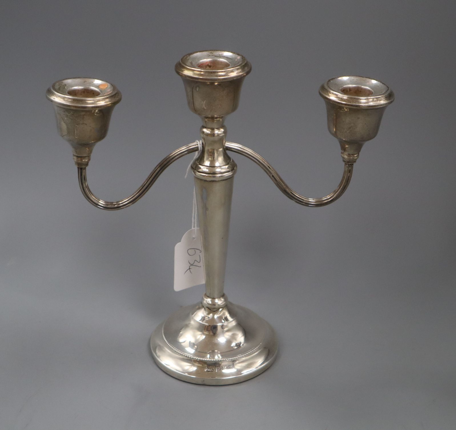 A modern silver two branch, three light candelabrum, 22.6cm.