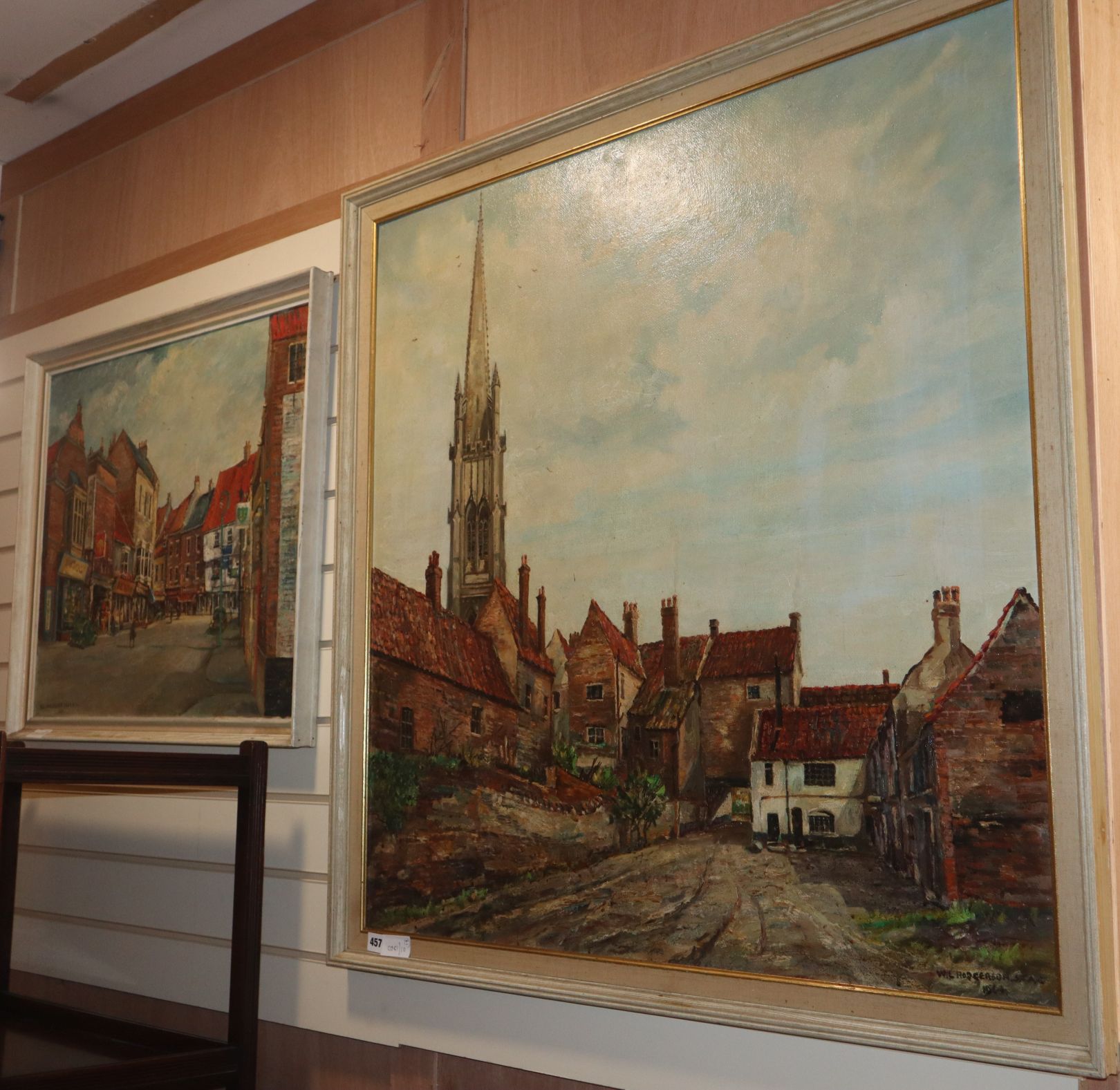 W.L. Rodgerson, two oils on board, Church and cottages and Street scene, largest 90 x 90cm