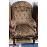 A Victorian mahogany spoonback armchair