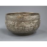 An Indian white metal bowl embossed with figures, 19cm.