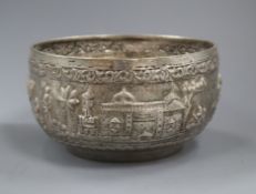 An Indian white metal bowl embossed with figures, 19cm.