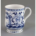 A Bow bell-shaped blue and white mug, c.1770 painted with flowers rockwork and insects, unmarked, H.