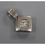 A white metal (stamped plat) and princess cut diamond set pendant, overall 18mm.