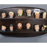 Twelve Royal Doulton Dickens miniature character jugs with Doulton display shelf