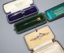 An Edwardian ruby & diamond set stick pin, a yellow metal and white opal bar brooch and a 9ct gold