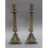 A pair of Renaissance style cast brass candlesticks height 41cm