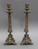 A pair of Renaissance style cast brass candlesticks height 41cm