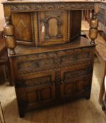 A reproduction oak court cupboard