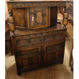 A reproduction oak court cupboard