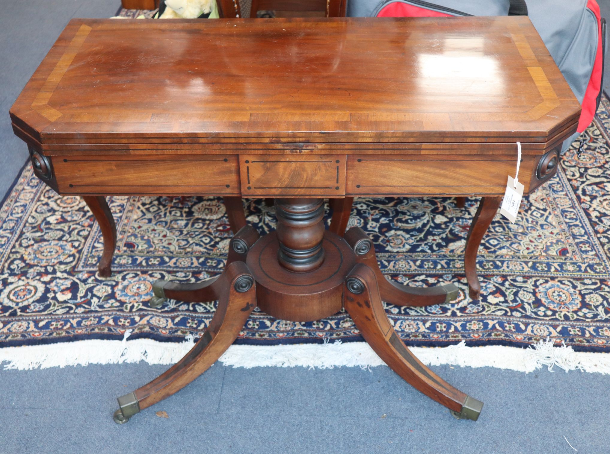 A Regency ebony strung mahogany card table W.90cm