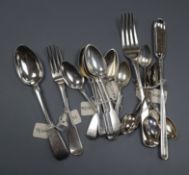 A George III silver marrow scoop, a harlequin set of seven fiddle pattern teaspoons, six George V