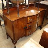 A 1920's mahogany serpentine sideboard W.136cm