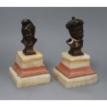 A pair of bronze busts of children on marble bases H.17cm