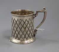 A Victorian embossed silver christening mug, Atkin Brothers, Sheffield, 1865, 92mm.