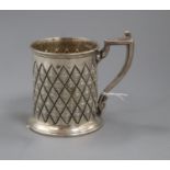 A Victorian embossed silver christening mug, Atkin Brothers, Sheffield, 1865, 92mm.