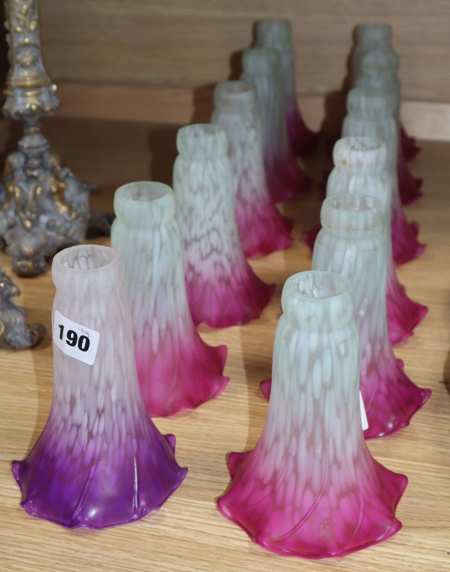 A set of twelve opaque glass lamp shades