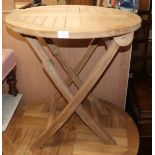 A circular teak circular folding garden table Diam. 70cm